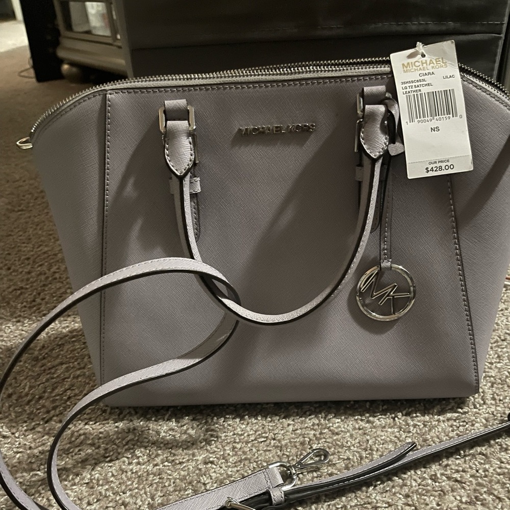 New Liliac color Michael Kors very pretty pest free home and smoke free.